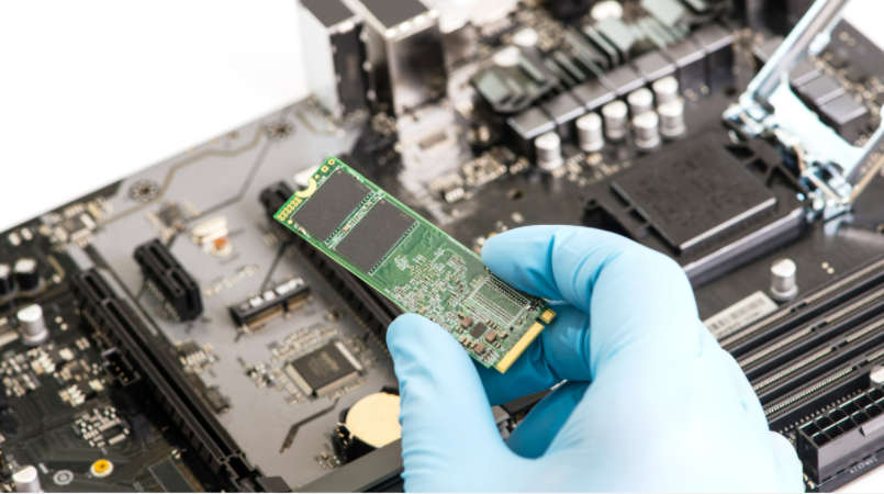 a man holding a nvme drive